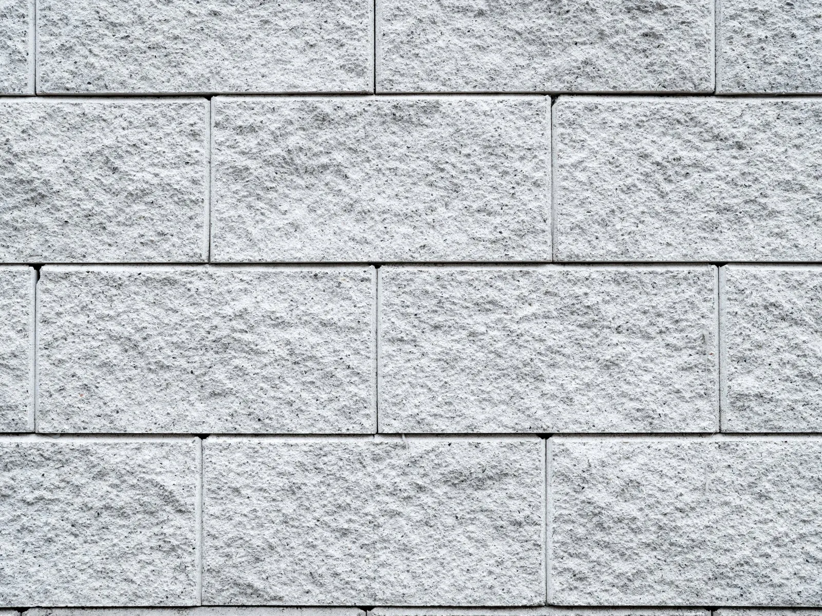 Textured concrete masonry block (CMU) wall surface, illustrative photo